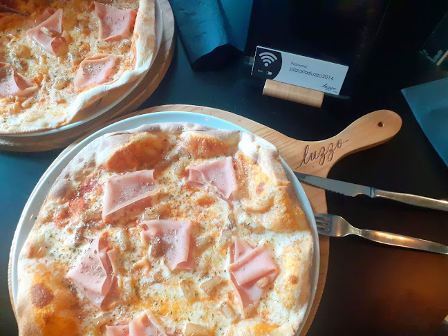 https://www.pizzarialuzzo.pt/